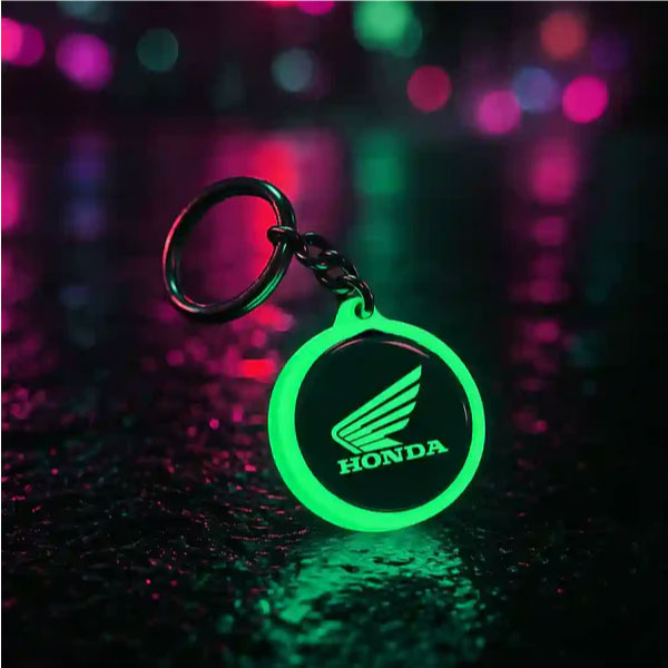 LED glow-in-the-dark acrylic keychain illuminated in the dark