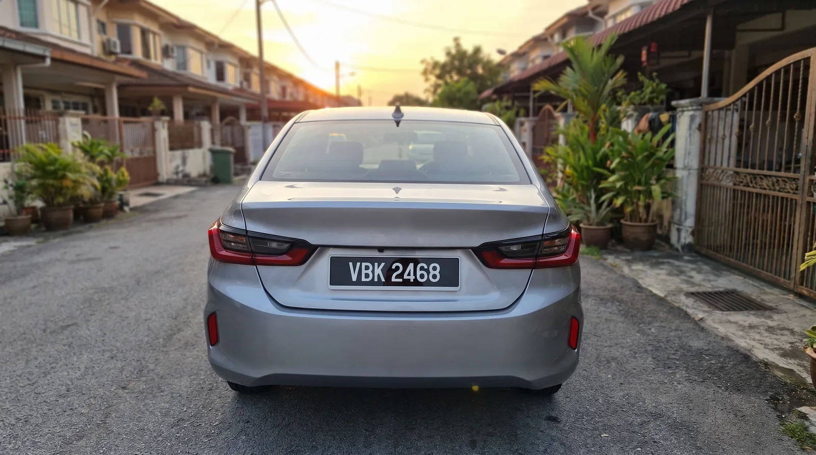 Rear of a Malaysian car with a standard black number plate reading VBK 2468, the format JPJ specifies