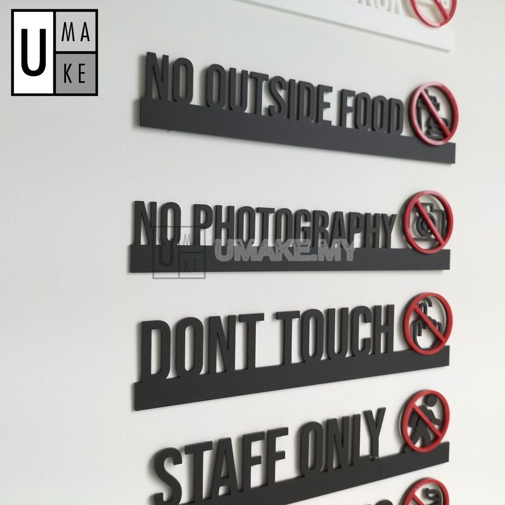 Modern acrylic notice sign for No Smoking and Staff Only mounted beside a door at eye level