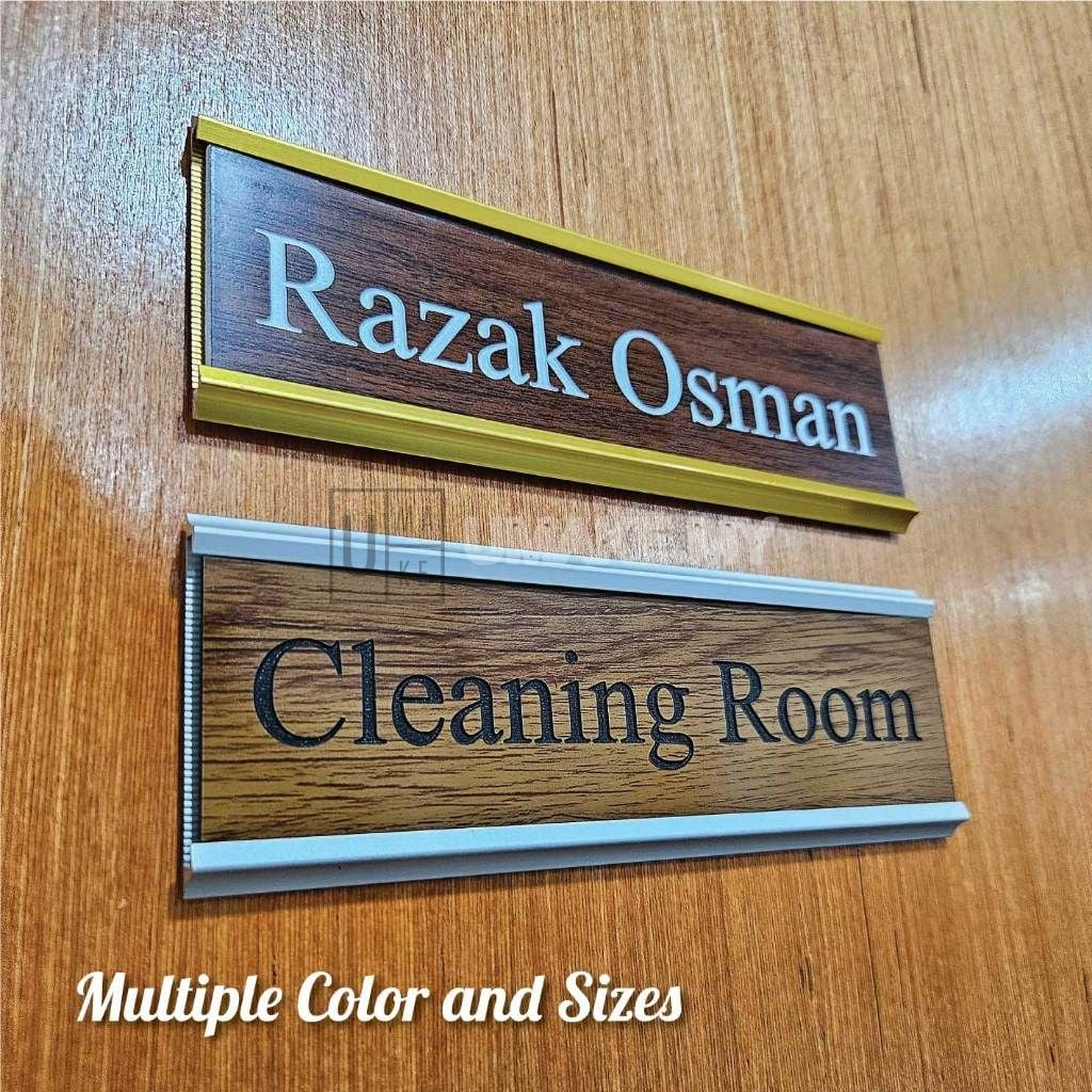 Changeable name plate mounted on office wall