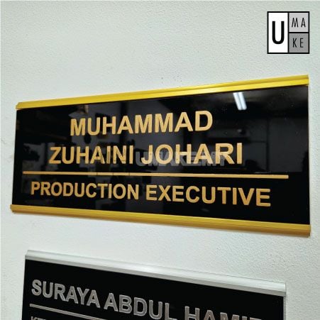Custom name plate showing gold aluminium frame detail