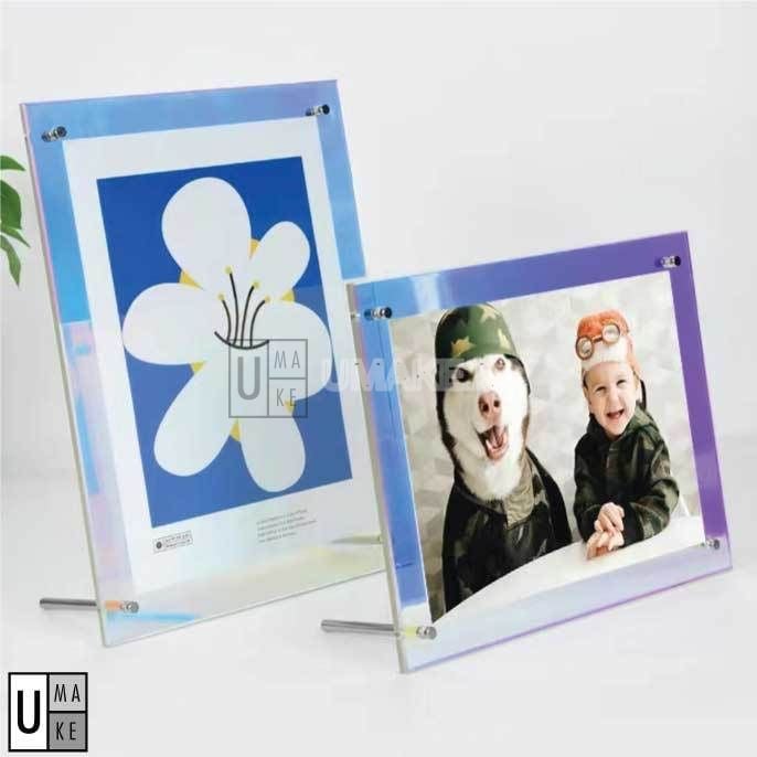 Acrylic certificate and photo frames displayed on desk with photos inside — by UMAKE Malaysia
