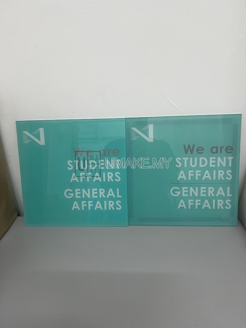 A sleek custom acrylic office sign with reverse UV printing, showcasing crisp text and branding, mounted on a modern wall in a professional Malaysian 