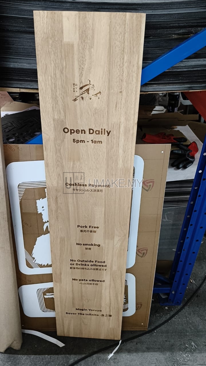 A precisely laser-engraved rubber wood sign with clean, custom text and natural wood finish, showcasing craftsmanship in Malaysian-made wood signage.