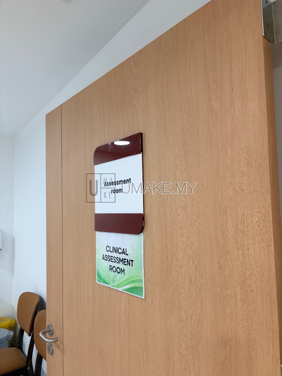 A sleek slotted acrylic sign mounted on a wall, showcasing precision laser-cut edges and a modern design for corridor identification in Malaysian offi