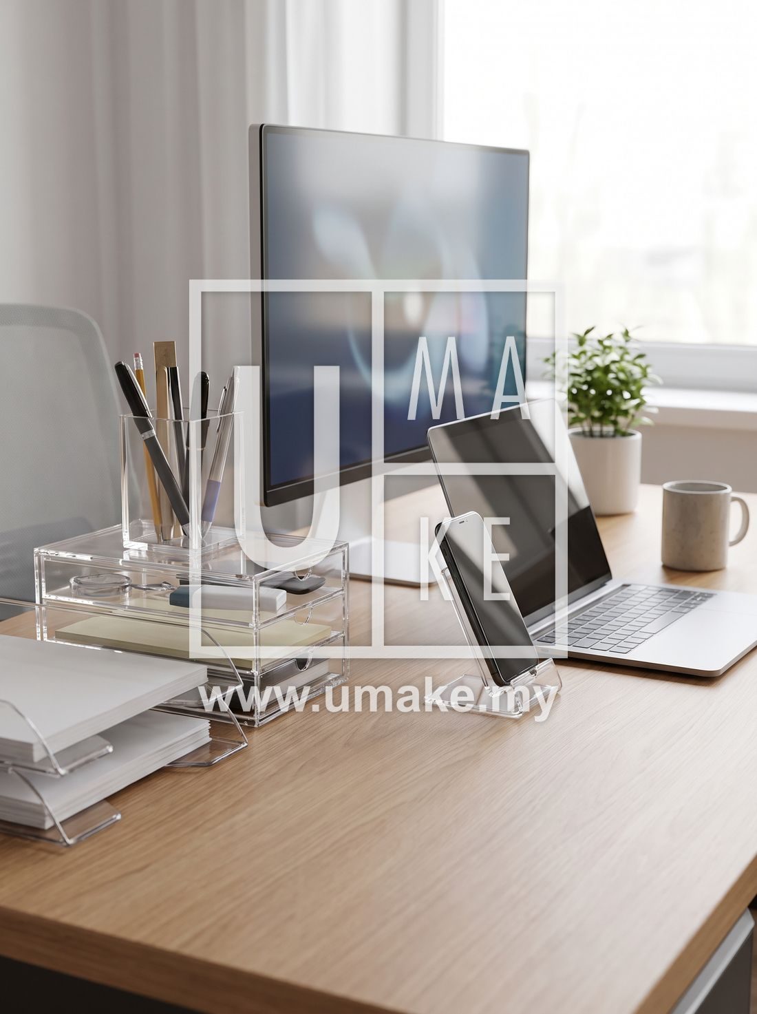 Office desk with clear acrylic organisers and phone stand