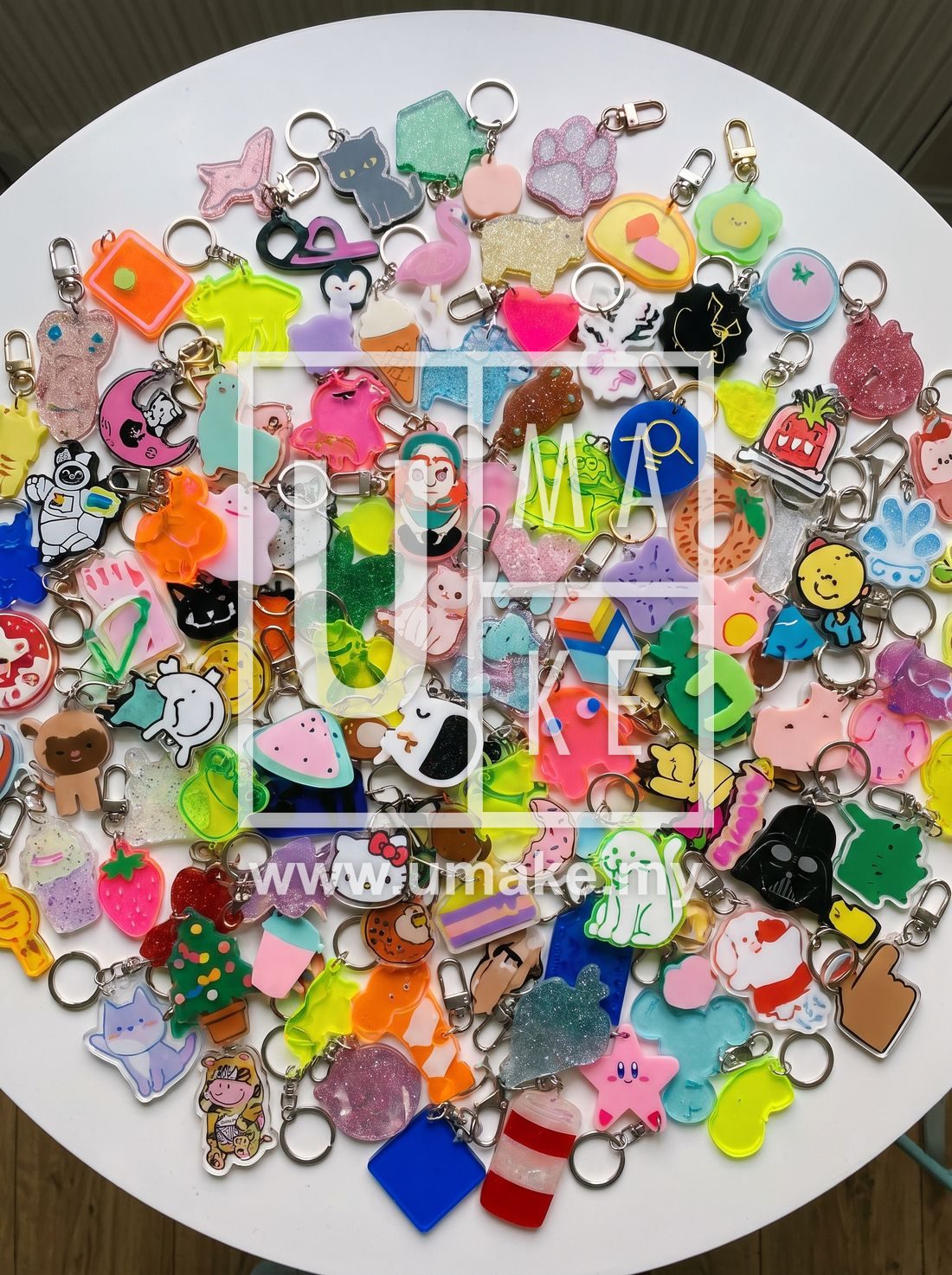 Colourful flat lay of many different acrylic keychains