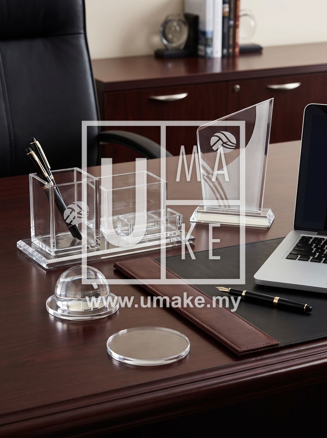 An elegant arrangement of branded acrylic corporate gift items on a desk