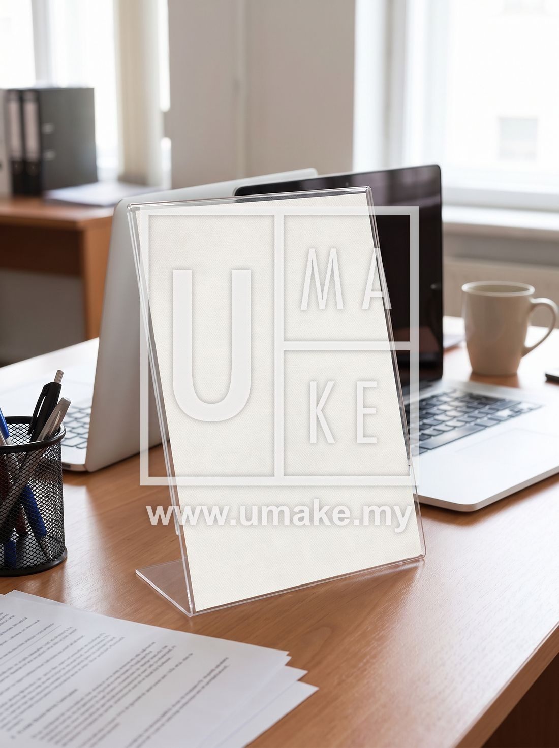 A clear acrylic certificate holder standing on an office desk