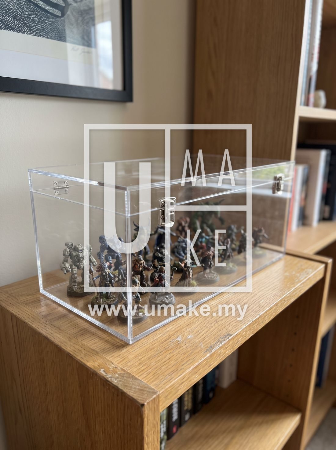 A clear acrylic display case protecting collectible figures on a shelf