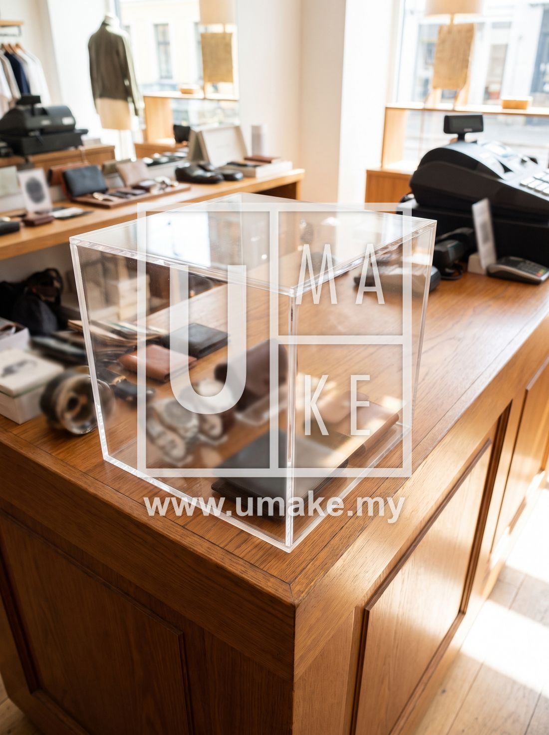 A dustproof acrylic showcase box on a retail counter