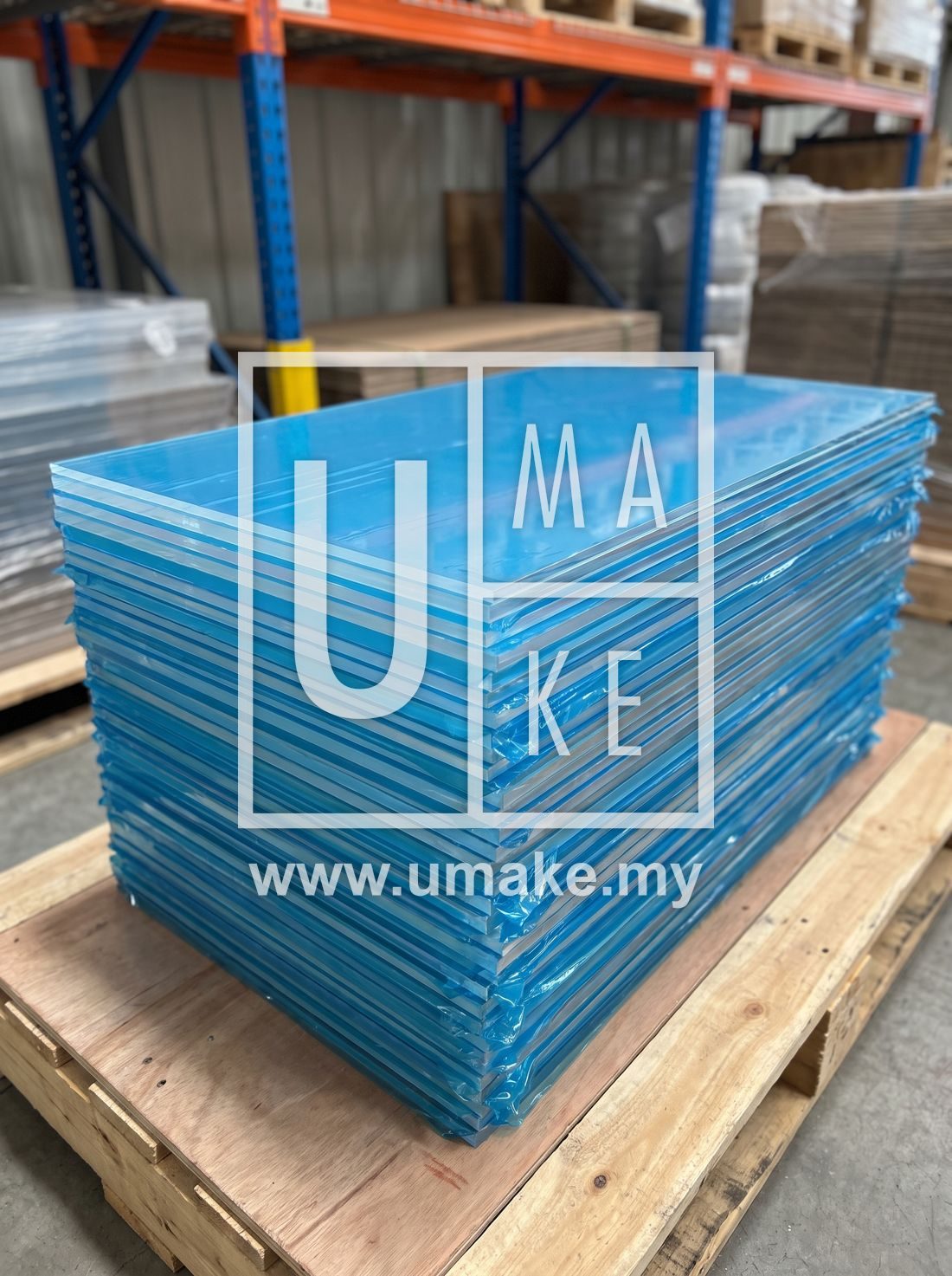 Clear acrylic sheets stacked neatly with protective film
