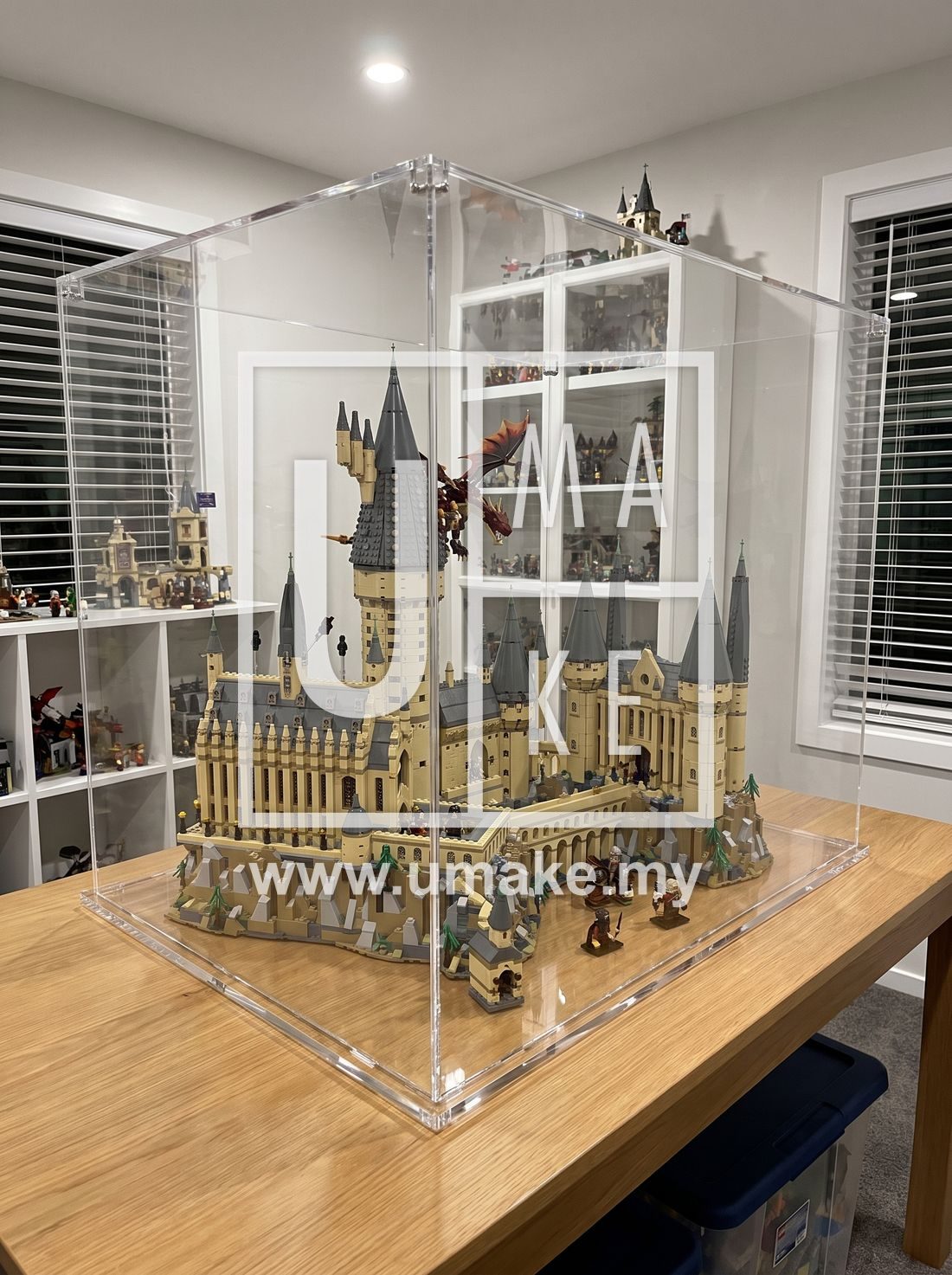 A large Lego set displayed inside a dustproof acrylic case