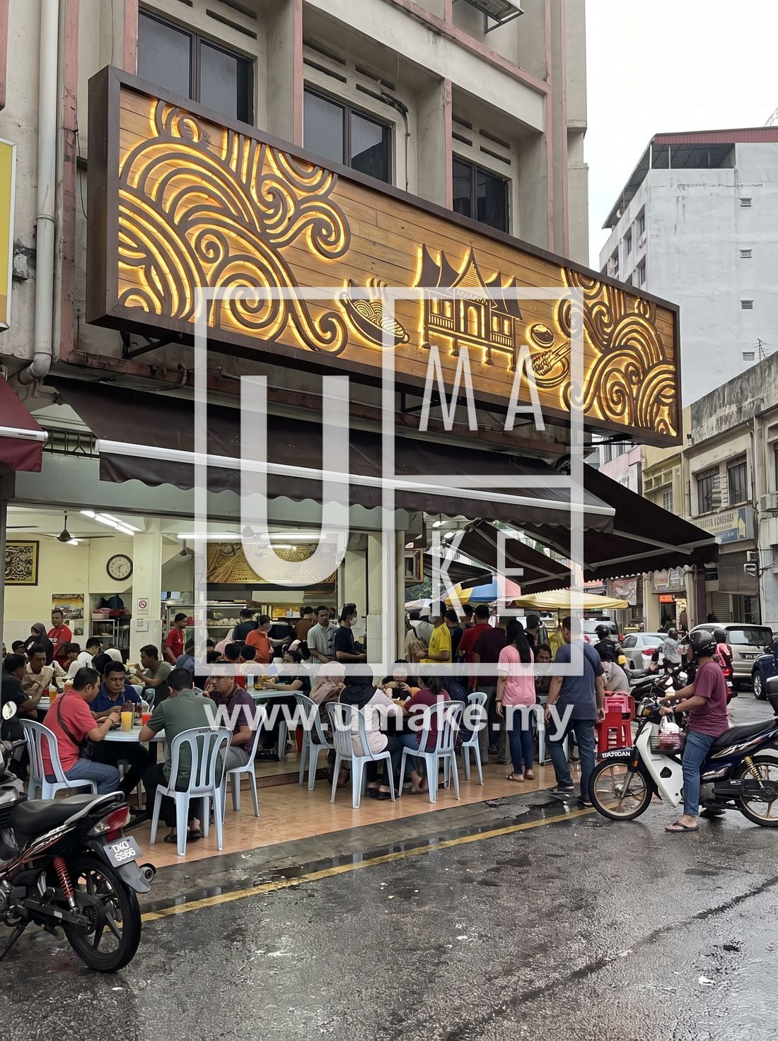 A busy Malaysian restaurant with an eye-catching custom signboard