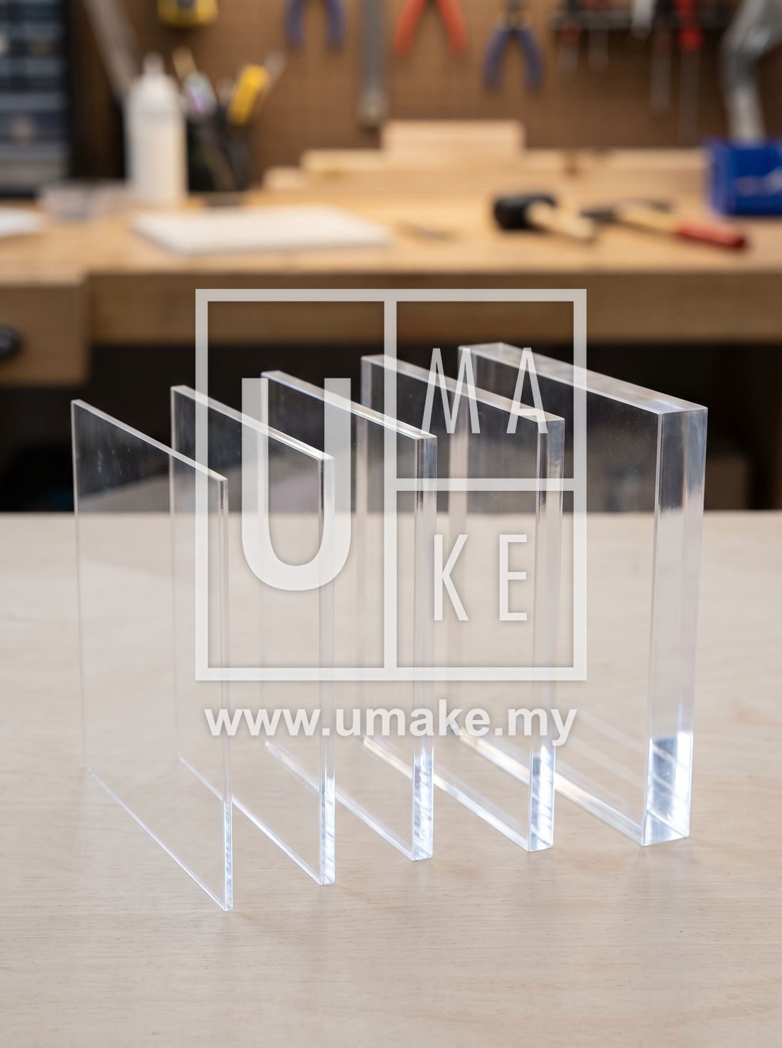 Different thicknesses of clear acrylic sheet compared side by side