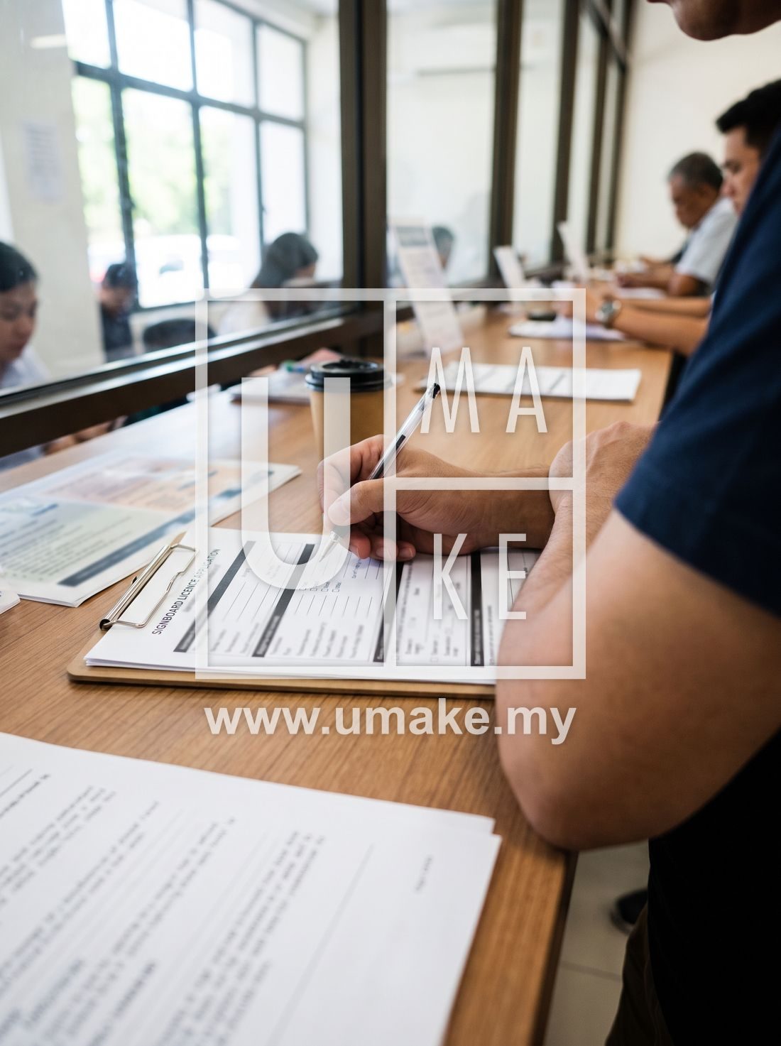 A person filling in a signboard licence application form