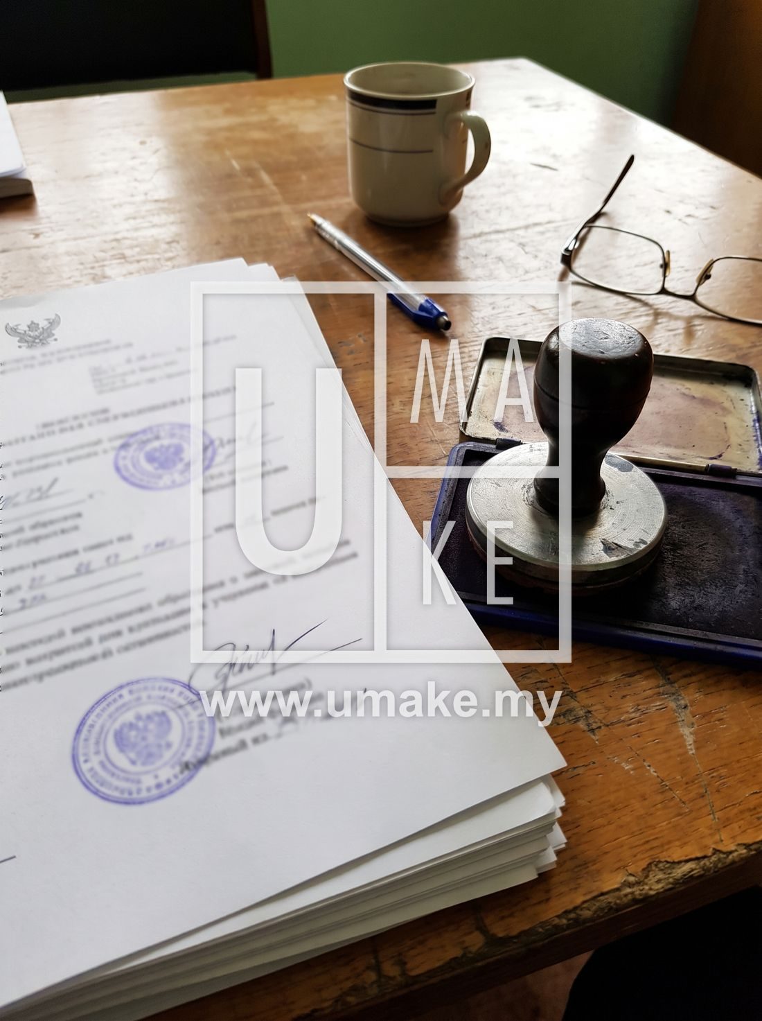 Signboard licence paperwork and a stamp on a desk