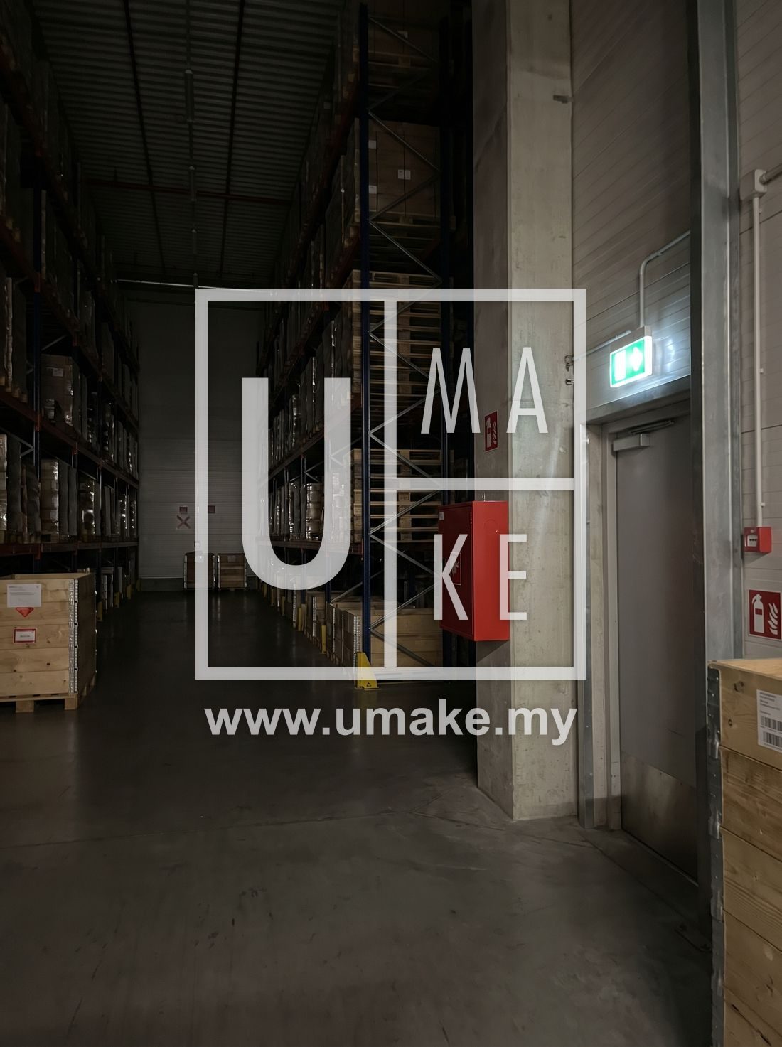A warehouse with fire extinguisher and exit signs