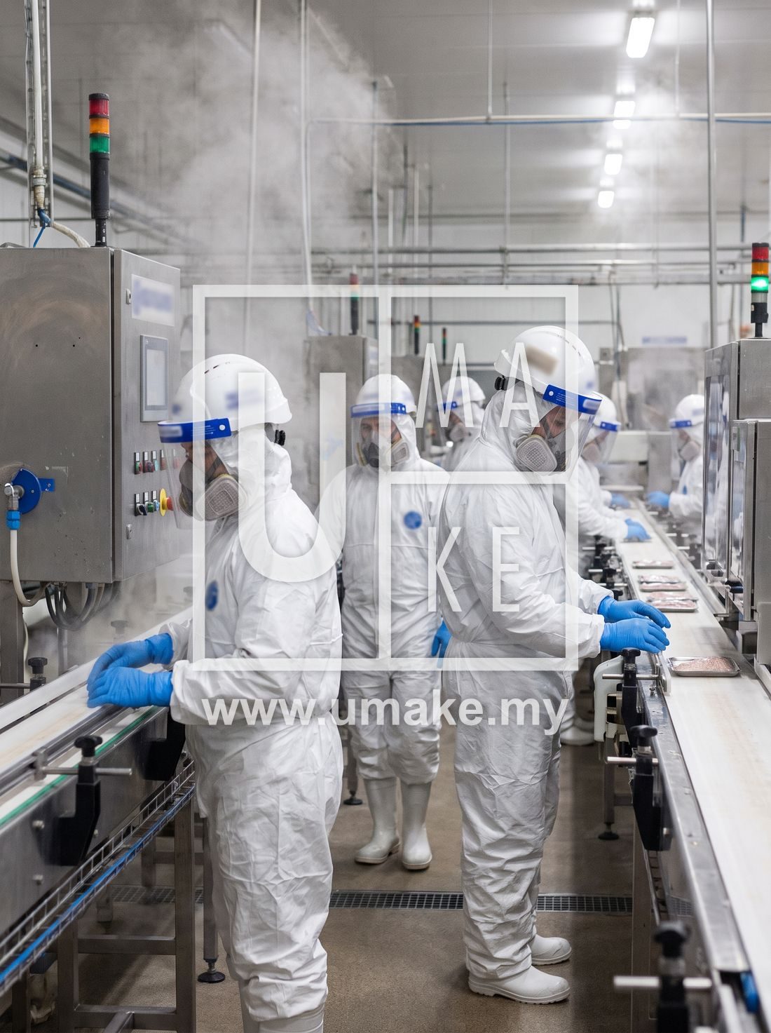 Factory workers in full PPE