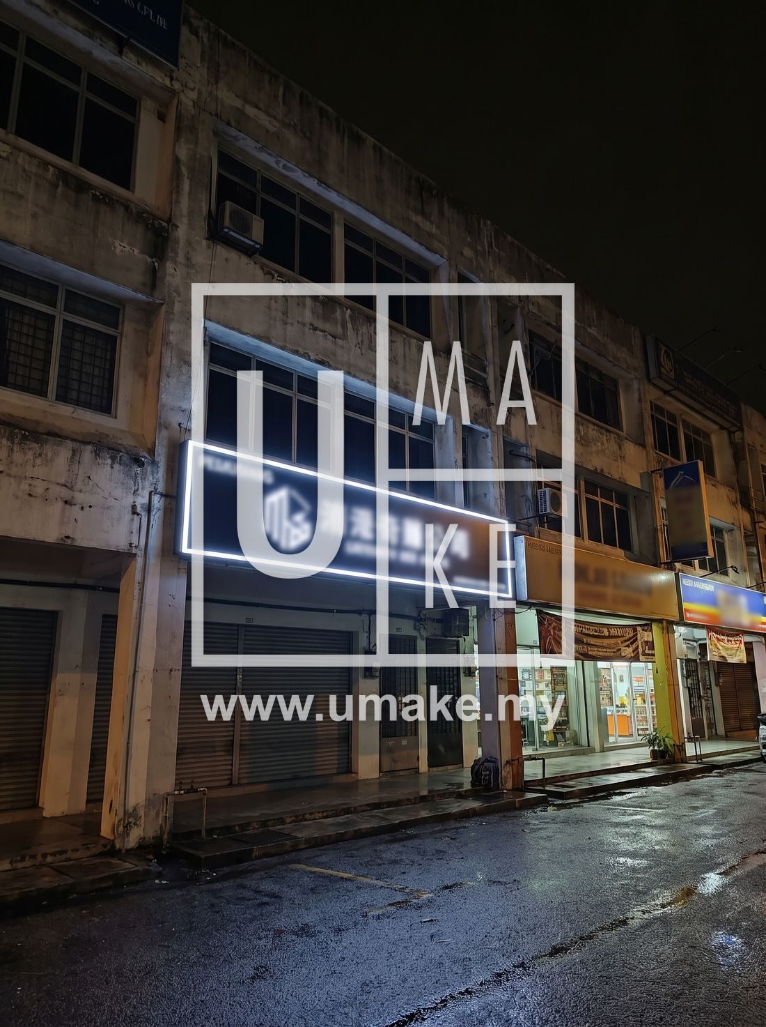 A compliant illuminated business signboard mounted on a Shah Alam shoplot facade
