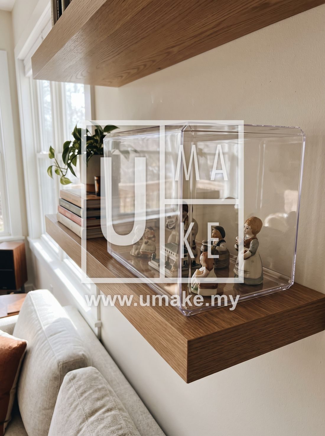 A dustproof acrylic showcase box on a living room shelf