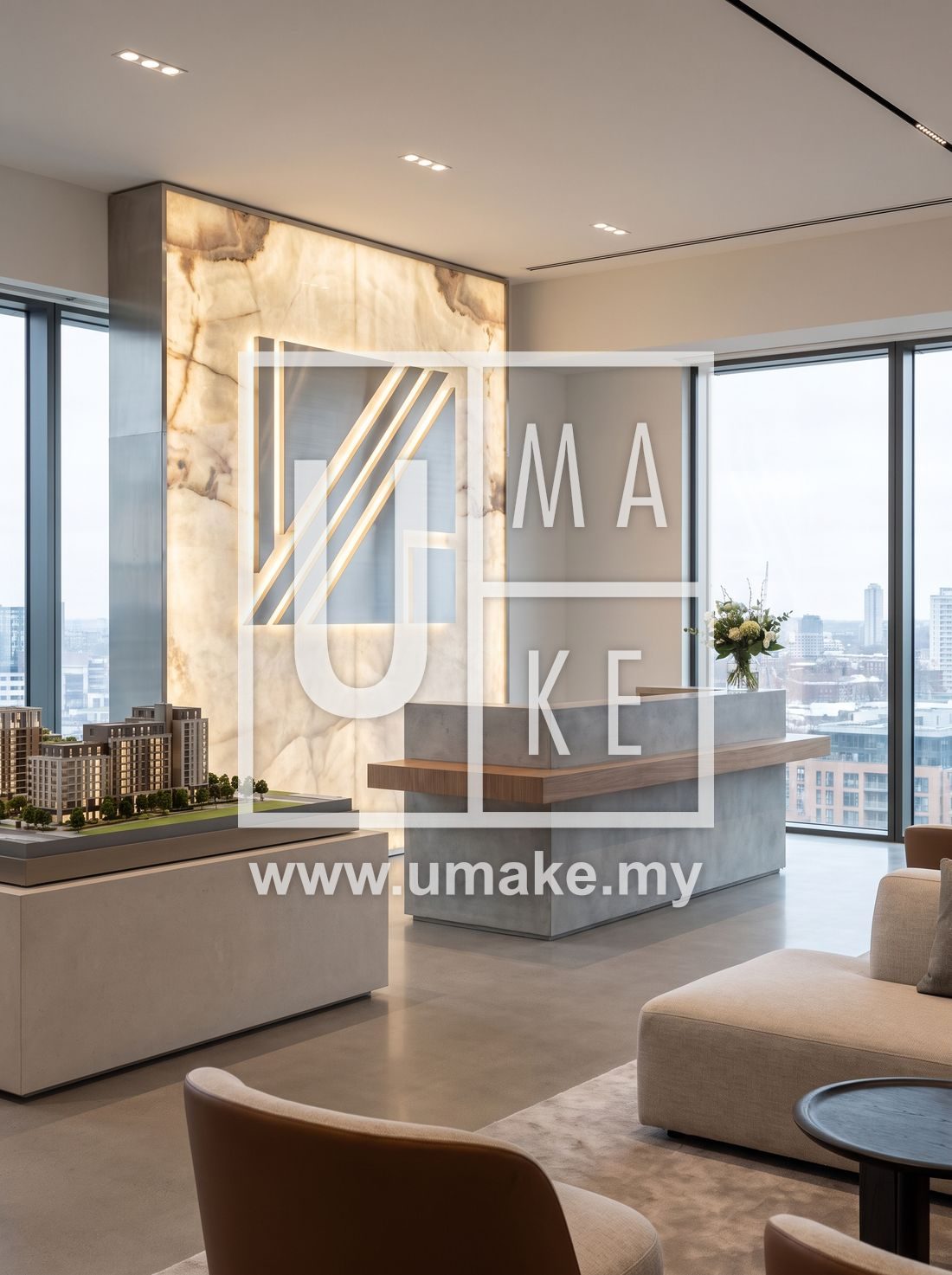 A modern property showroom reception with a backlit logo sign