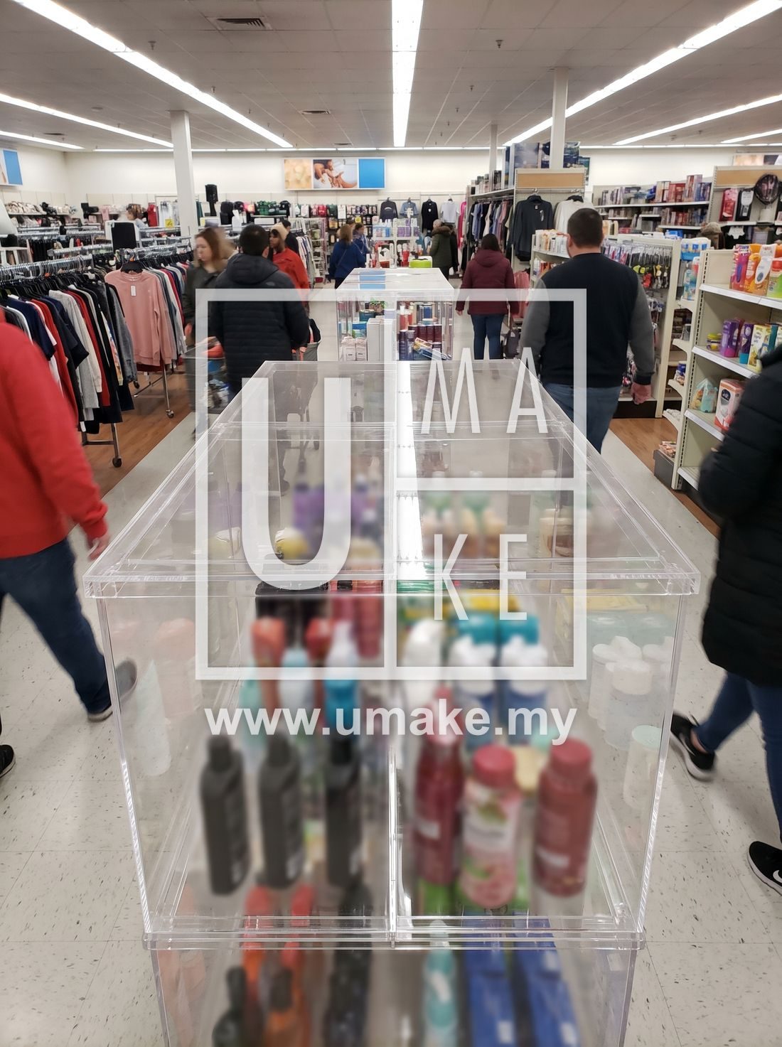A shatterproof acrylic showcase in a busy retail shop