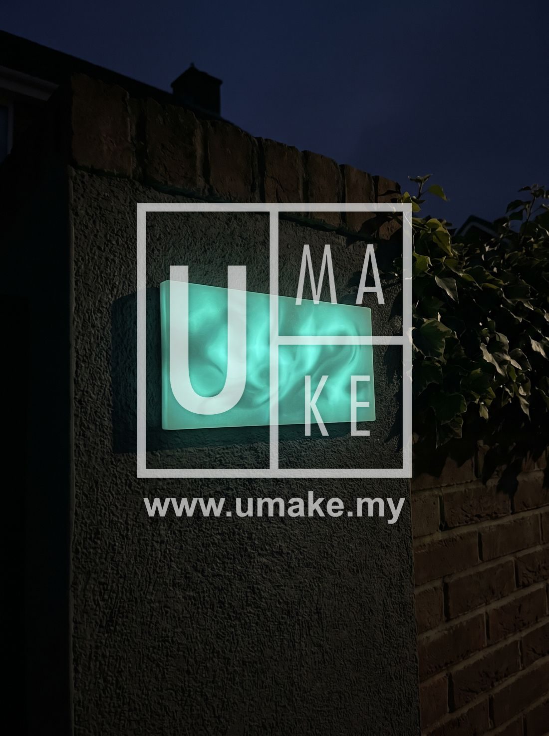 A glow-in-the-dark house number plate glowing on a house wall at night