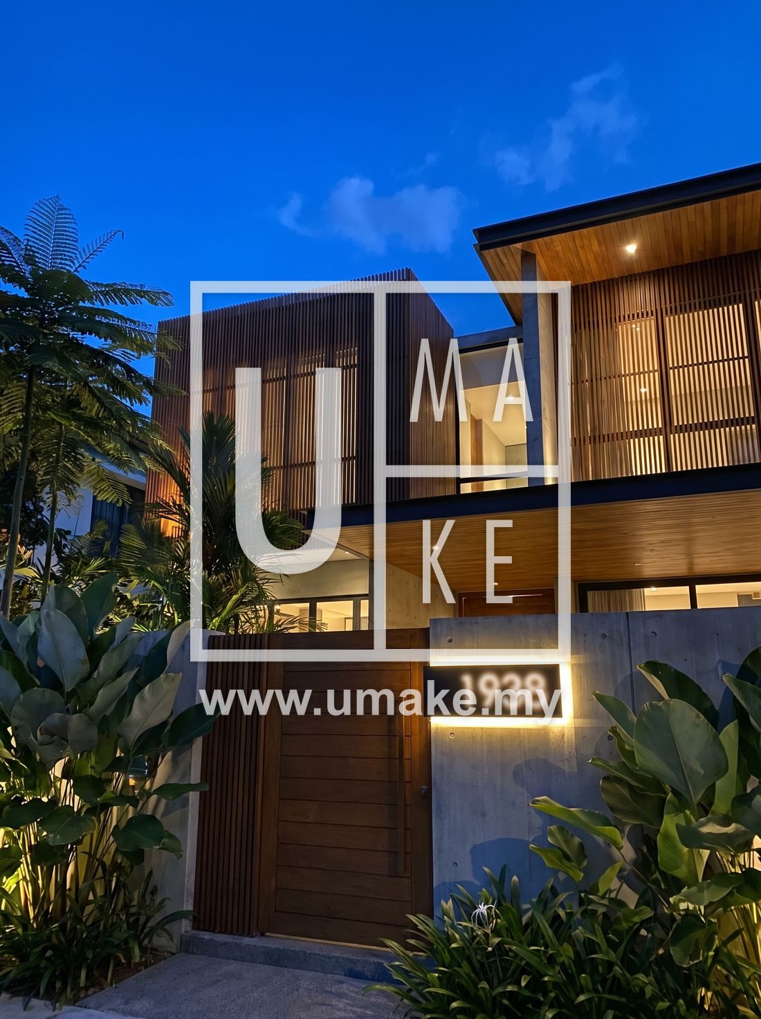 A modern Malaysian house facade with a lit house number at dusk