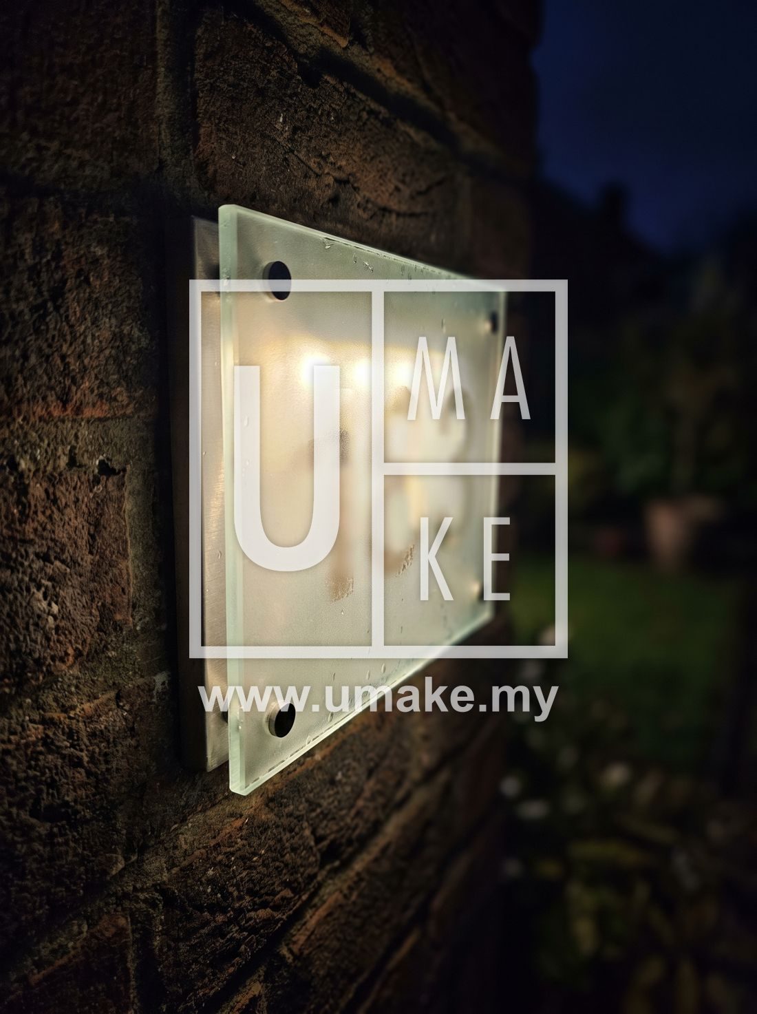 A close-up of a luminous house number plate in the dark